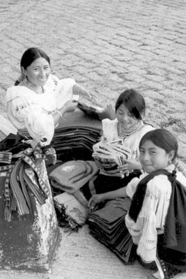 Indian girls selling beautiful scarves near our bus in Quito, Ecuador.