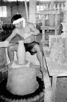 Potter at work at a ceramics factory.