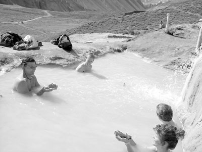 Group applying mudpacks at Baños Colina.