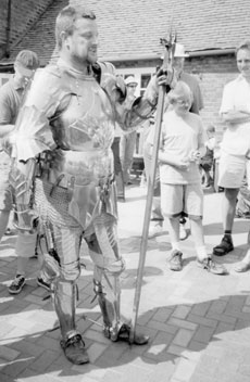 This knight was being equipped with his armor at the Battle of Bosworth reenactment. 