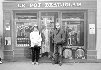 Paula and David Prindle share cooking tips “with” Lyon native chef Paul Bocuse at one of the trompe l’oeil murals in Lyon.