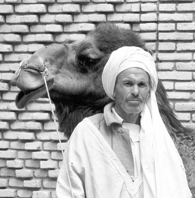 This man earns his living posing for tourists in the palm grove in Nefta.