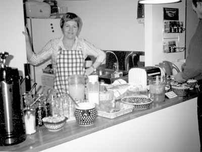 Louisa gets the breakfast buffet ready at Guesthaus Sunna. Photo: Rees