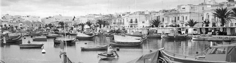 A view of colorful boats in the harbor at the fishing village of Marsaxlokk.