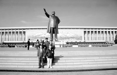 Our tour group (I’m at front left) at the bronze statue of the Great Leader, Kim Il Sung — P’yongyang.