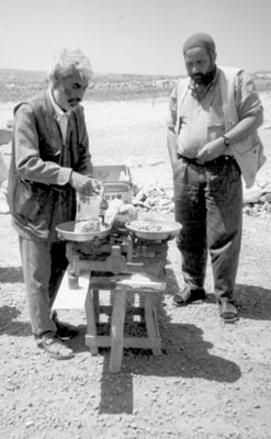 Buying pistachio nuts at a roadside stand.