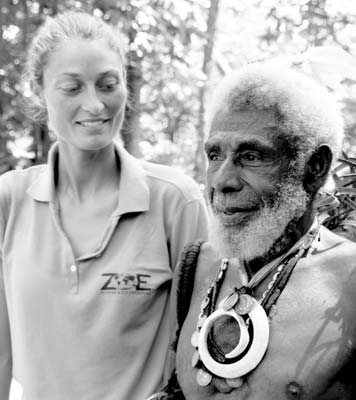 Natalia Baechtold, Zegrahm divemaster and photographer, seems to have her eye on the necklaces of this Ambrym Island chief.