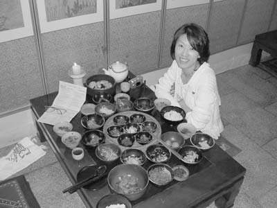 Goodwill Guide Young-bin at lunch at Sanchen. All Korean meals have several side dishes, usually four to six. This meal, with about 15, was the most elaborate I saw. Photos: Graper