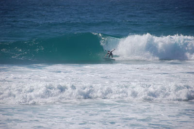 A surfer ripping a right on Mozambique’s premier Tofino point break.