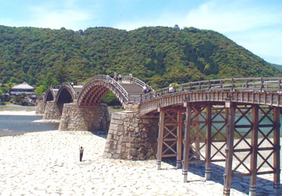 Kintai bashi in Iwakuni, Japan. The warlord’s castle is atop the ridge on the right side of the photo. Photo: Bernard Storch