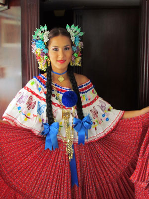 On our half-day canal cruise, this woman, in beaded headdress, colorfully embroidered blouse and red skirt, provided photo ops. 