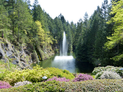 A pond with a water fountain marks the far end of the Sunken Garden.