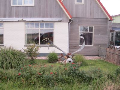 Yard ornament — World War II fighter plane propeller, possibly a German ME 109. Photos by Jim Ure<br />
