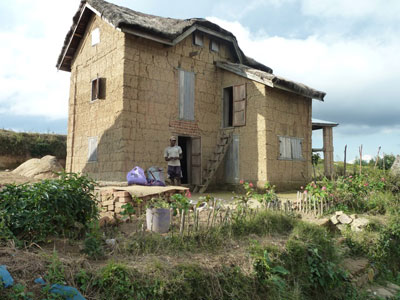 The cooking area in this mud-brick house is upstairs so the charcoal-generated heat will help keep the thatch roof dry — Antsi­rabe region of Madagascar. Photos: Dintzis<br />
