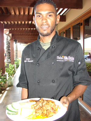 Chef Dwight Stamper presenting goat stew. Photo by Sandra Scott<br />
