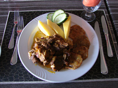 The goat stew, plated. Photo by Sandra Scott