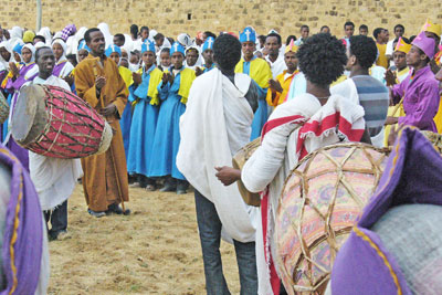 Priests in religious regalia and carrying huge ceremonial umbrellas gathered at tents housing the tabots in Adwa. Photo by David J. Patten