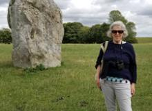 Edna R.S. Alvarez in front of one of the stones at Avebury.