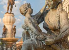 One of four statues of mothers around the Fountain of the Mothers of Macedonia in Skopje, North Macedonia. In the background, on a 15-meter-tall platform, is a 13-meter-tall bronze statue of Philip II, father of Alexander the Great.