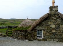 Thatch-roofed croft houses in the village of Gearrannan on Lewis Island, the largest of the Outer Hebrides.