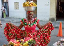 A fruit vendor in traditional costume in the walled city of Cartagena. Photos: Keck