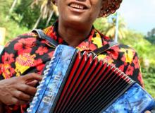 An accordion player welcomes Noordam passengers to the port of Samaná, Domincan 