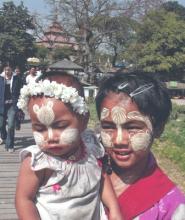 Woman and child with faces decorated — Mandalay