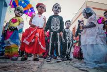 Children pausing during a parade through the streets of Oaxaca.