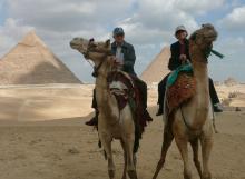 Riding camels to the Great Pyramids.