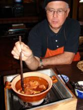  John Scott checking on the Caramel Pork in Clay Pot.