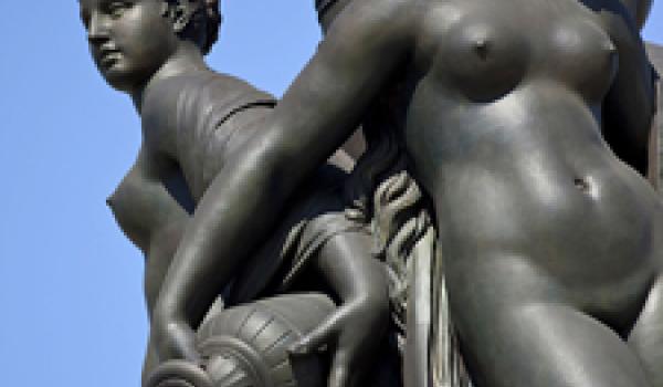 Cast in bronze, with a marble base, the Three Graces fountain (1869) in Place de la Bourse, Bordeaux, France, depicts Zeus’ daughters Aglaea (Splendor), Euphrosyne (Mirth) and Thalia (Good Cheer).