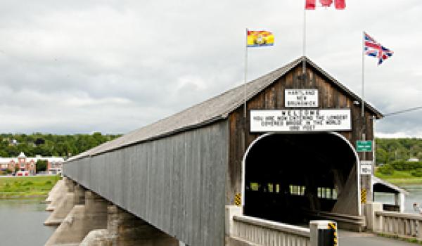 The Hartland Covered Bridge, built in 1901 and covered in 1921, is the world’s longest covered bridge, stretching 1,282 feet over the Saint John River in New Brunswick, Canada.