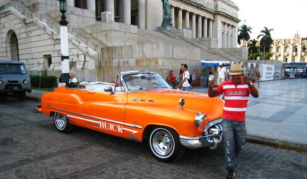 Many visitors equate Cuba with vintage American cars, which were brought to the island before Fidel Castro seized power in 1959. Many, like this one, are used as taxis. Photo by Tom Auciello