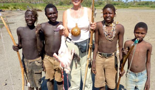 Suzi Colman shows off the flamingo found on her outing with the Hadza huntsmen.