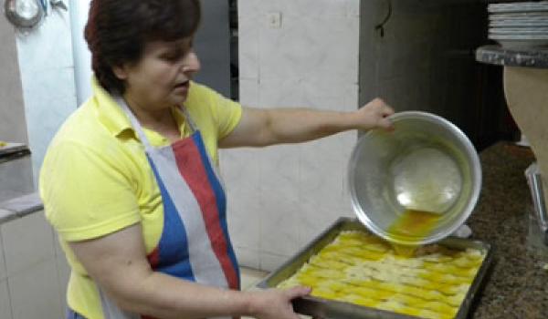 Violeta putting the finishing touch on the baklava. Photo: Sandra Scott