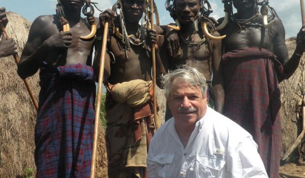 Larry Kritcher with members of the Mursi tribe.