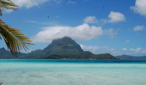 Bora Bora with the famous Mt. Otemanu covered by a cloud.