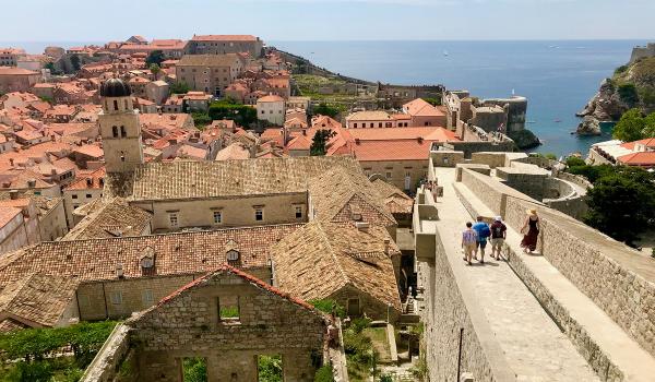 Strolling atop the wall overlooking Dubrovnik. Photo by Trish Feaster