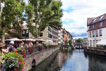 Strasbourg’s half-timbered buildings provide a Germanic backdrop for an Alsatian meal on this riverfront terrace.