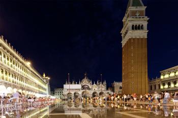 Nighttime on St. Mark’s Square comes with ambience-filled cafés, dueling orchestras, and sometimes some atmospheric flooding.