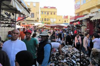 Abdellah (center front, in hat and vest) in Meknes' Sunday market. Photo by Stephen Addison