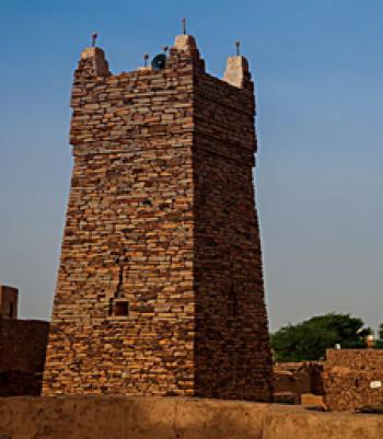 In the Western Sahara, the oasis city of Chinguetti, Mauritania, features the massive minaret of the 13th-century Chinguetti Mosque. Photo: © Sergey Mayorov/123rf