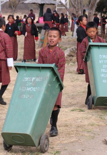 Schoolboys assisting with the morning cleanup at an elementary school we visited.