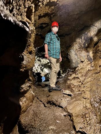 Low ceilings make a hardhat necessary in Gruta do Natal, the Christmas Cave, on Terceira Island. (We were indoors, so a mask was necessary.) Photo by Susan Dailey