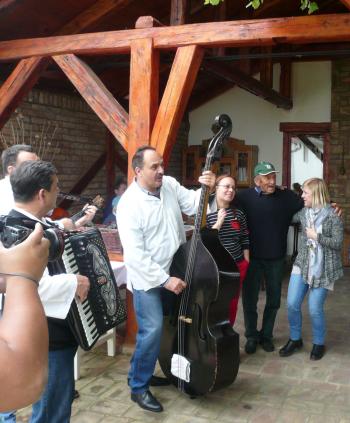 Tosha (at right, behatted) dances and sings us adieu.