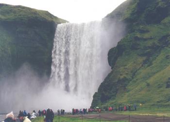 Massive waterfall in Iceland. Photo by Jim Delmonte