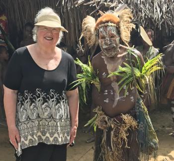 Sandy Fassett with a performer at the Tumbuna Sing Sing. Photo by Larry Fassett