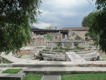 Monastery ruins blend with the surrounding foliage and the modern architecture of Hotel Casa Santo Domingo.