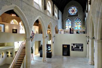 The Belvedere, with its straight lines, does not touch the historic church’s walls but adds exhibition space within the museum. Photo by John Chase, The Garden Museum