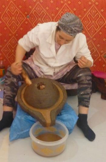 A worker extracting argan oil at a women’s cooperative near Essaouira. Photo by Randy Keck